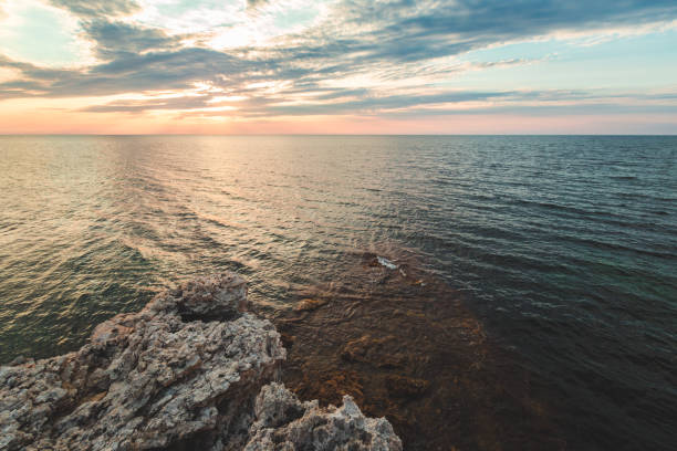 istock Brilliant vacation destination beach sunrise and sea cliffs background 1022242748