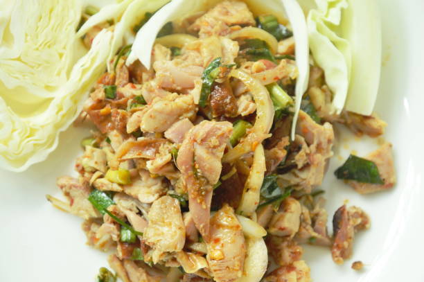istock spicy roasted chicken Thai salad with cabbage on plate 1022243020