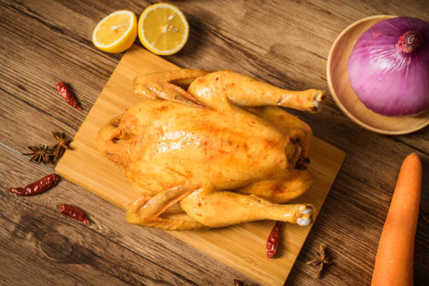 istock Roast chicken on the wooden table 1022249352