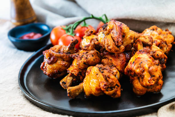 istock roasted sleeves chicken with potatoes and barbecue sauce 1022249600
