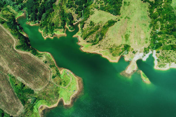 istock Aerial top view of lake between mountain forest 1022250054