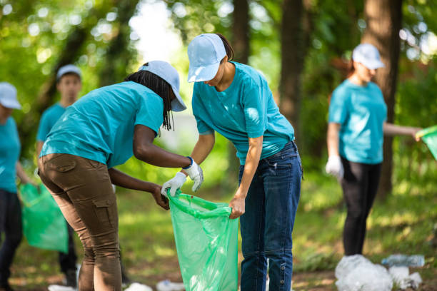 istock Two women cleaning the park 1022255212