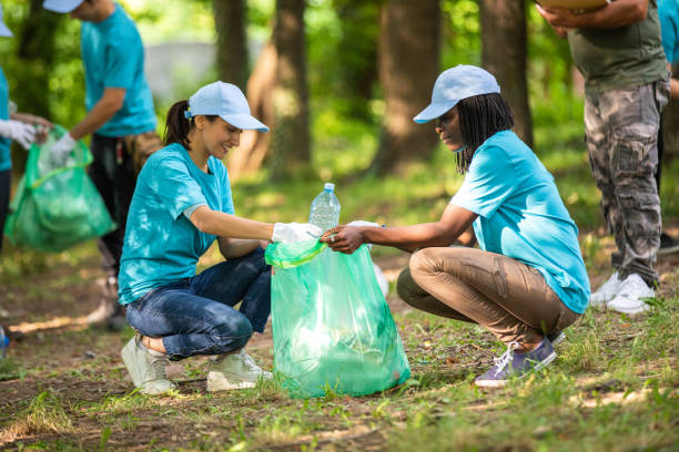 istock Two women cleaning the park 1022255220