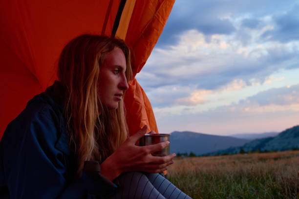 istock Woman Enjoying Evening In Tent 1022255348