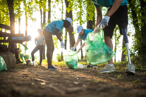 istock Young man with prosthetic leg cleaning the park 1022255810