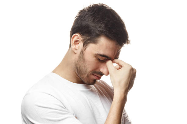 istock Negative emotion concept. Young man crying about his failure, feeling bad about unpleasant situation. 1022259732