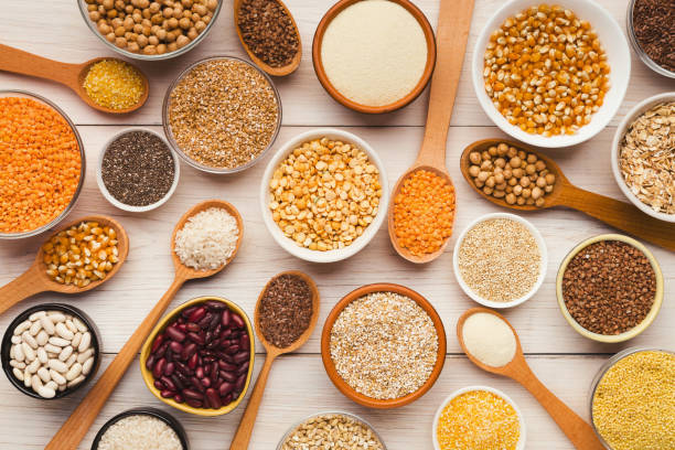 istock Cereals and legumes assortment on wooden table 1022260272