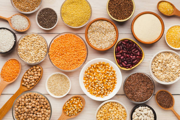istock Cereals and legumes assortment on wooden table 1022260396