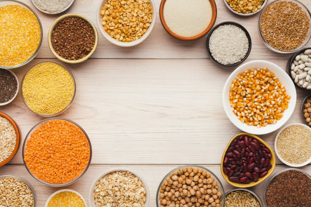 istock Cereals and legumes assortment on wooden table 1022260490