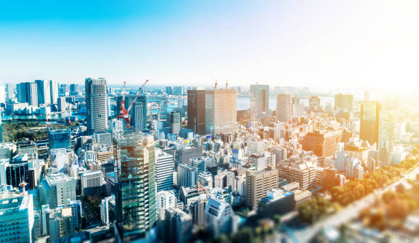 panoramic modern city skyline in Tokyo, Japan with miniature lens tilt shift blur effect Business and culture concept - panoramic modern city skyline bird eye aerial view under dramatic blue sky in Tokyo, Japan. miniature lens tilt shift blur effect tilt shift stock pictures, royalty-free photos & images