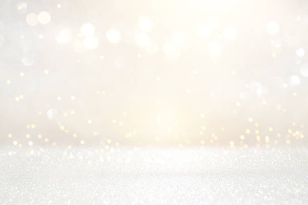 istock glitter vintage lights background. silver and light gold. de-focused. 1022269218
