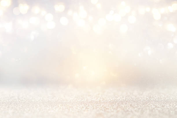 istock glitter vintage lights background. silver and light gold. de-focused. 1022269394