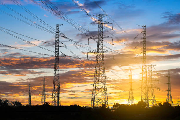 istock High voltage electric tower on sunset time and sky on sunset background. Power Tower 1022270498