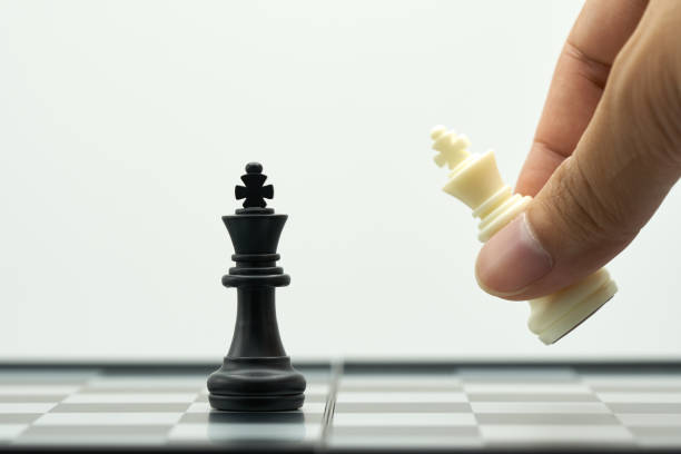 istock Businessman holding a King Chess is placed on a chessboard.using as background business concept and Strategy concept with copy space for your text or design. 1022272064