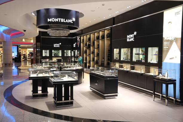 Montblanc store People shop at Montblanc store at Dubai International Airport, United Arab Emirates. The German brand Montblanc is famous for pens, watches and jewellery. jewelry store stock pictures, royalty-free photos & images