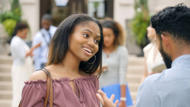 istock Attentive college student talking with friend 1022278210
