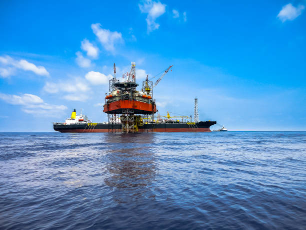 istock Jack up drilling rig and FPSO ship in oil field 1022278310