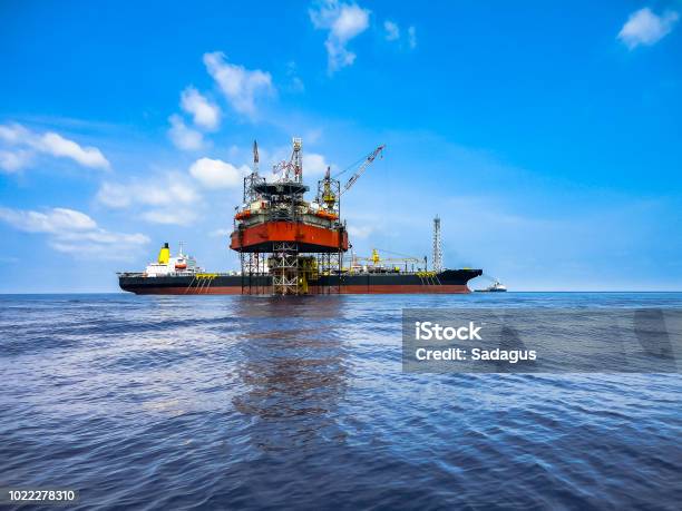 Jack Up Drilling Rig And Fpso Ship In Oil Field Stock Photo - Download Image Now - Floating On Water, Nautical Vessel, Offshore Platform
