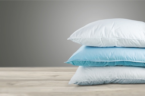Soft Pillows Pile on grey background