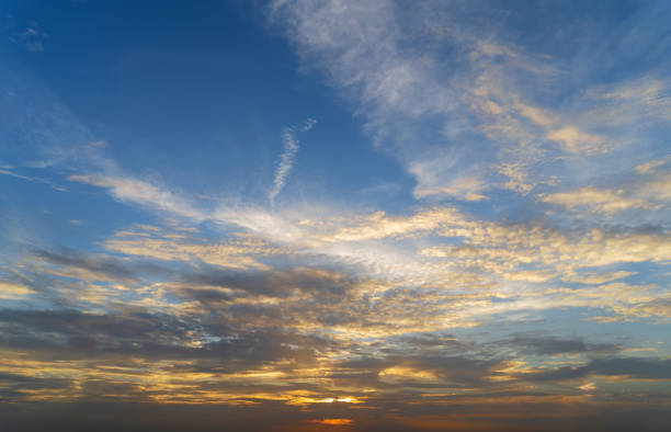 istock Blue sky with yellow colorful sunset clouds in twilight time 1022278750