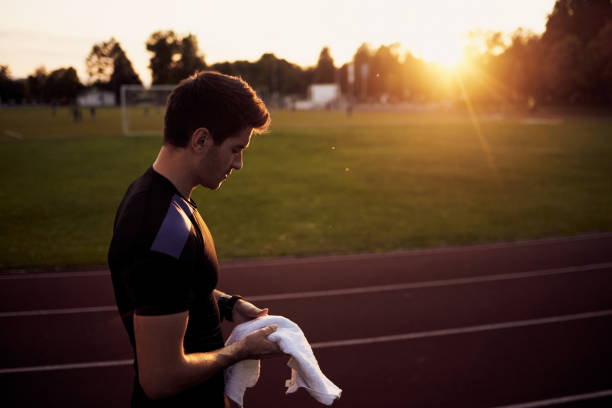 istock Young male runner getting ready for the run during the sunset 1022283348