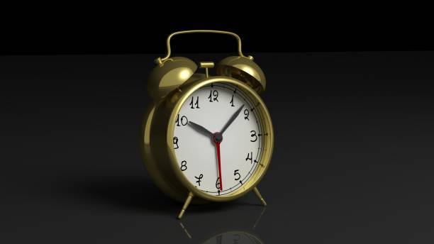 istock Retro gold alarm clock, isolated on black background. 1022284280