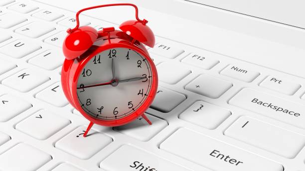 istock Red alarm clock on white laptop keyboard. 1022284454