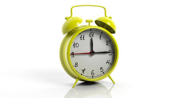 istock Retro yellow alarm clock, isolated on white background. 1022284458