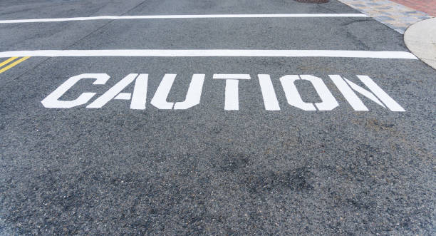istock Caution sign and line painted on the street 1022294654