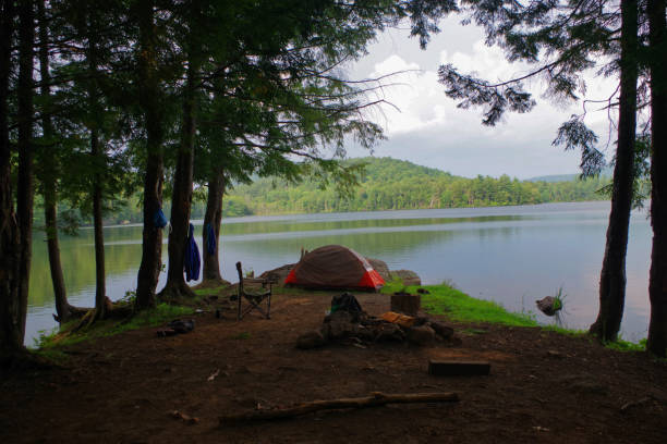 Campsite and tent on a lake in the Adirondack Mountains stock photo