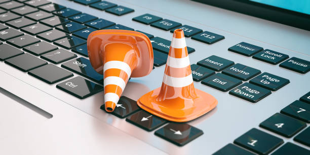 istock Traffic cones on a laptop, 3d illustration 1022317624