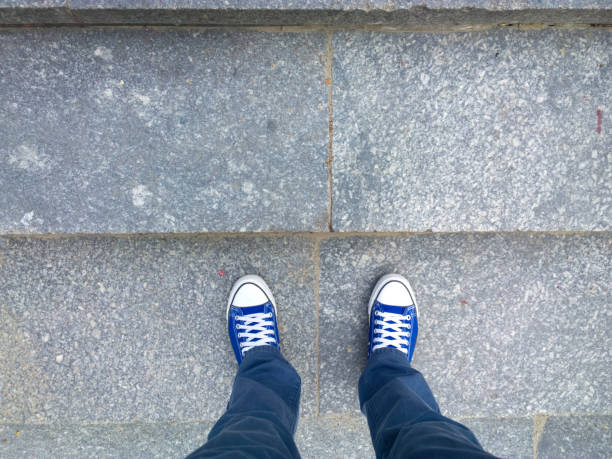 Feet on the stairs. Feet on the stairs. personal perspective standing stock pictures, royalty-free photos & images