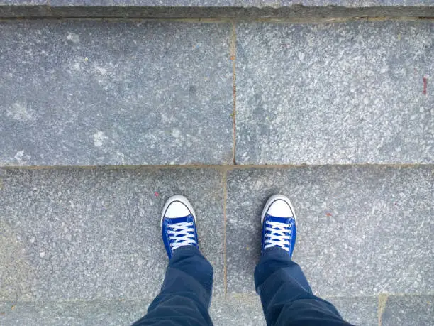 Photo of Feet on the stairs.