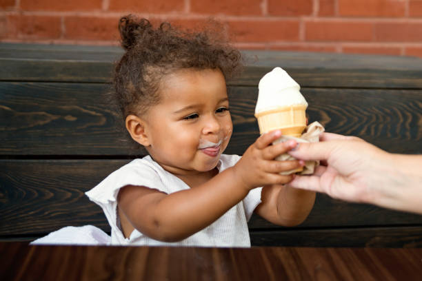 istock A ice cream cone make this cute toddler very happy. 1022328878