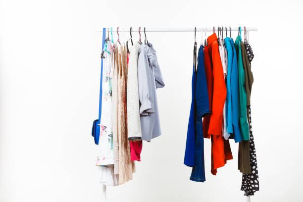 istock Clothes on hangers in closet 1022332106