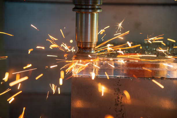 istock The CNC milling machine cutting the mold part in roughing  process with the lighting ship. 1022336334