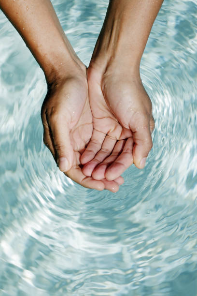 istock Clear water in woman hands 1022337402