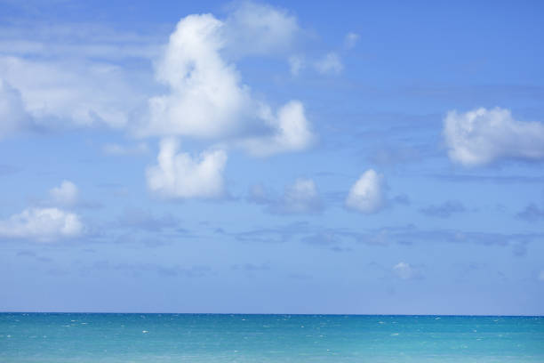 istock Blue sea and sky with clouds over it 1022344874