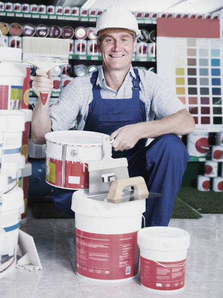 istock man choosing paint bucket 1022345380