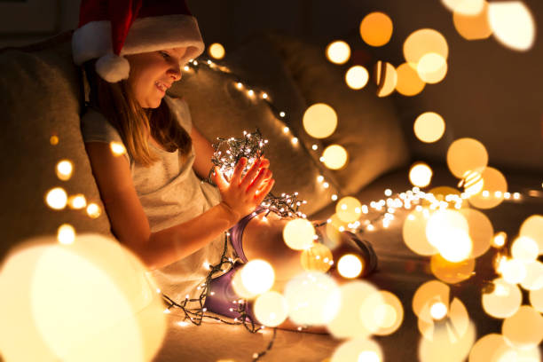 istock Christmas lights and a child 1022348014