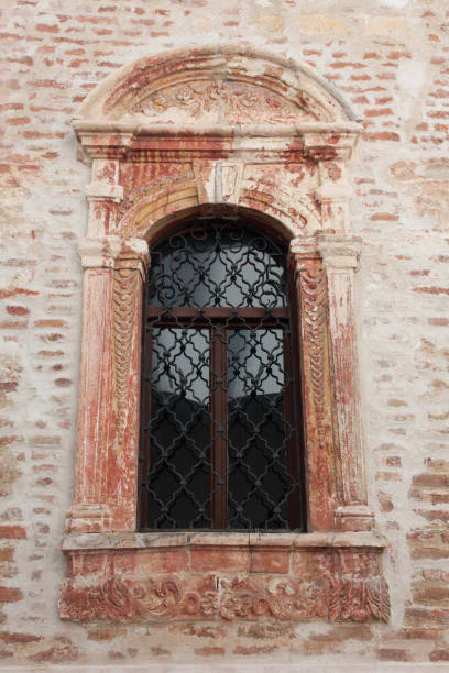 istock Old window on a medieval church 1022348760