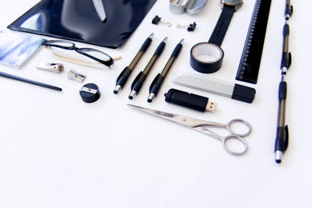 istock stationery pen scissors notebook on a wooden table 1022351306