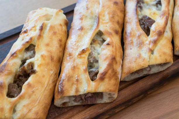 istock Turkish Bafra Pide with Minced Meat Kavurma Salad and Pickles. 1022352202