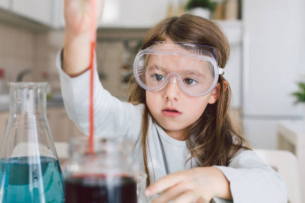 istock Little girl playing science at home 1022352302