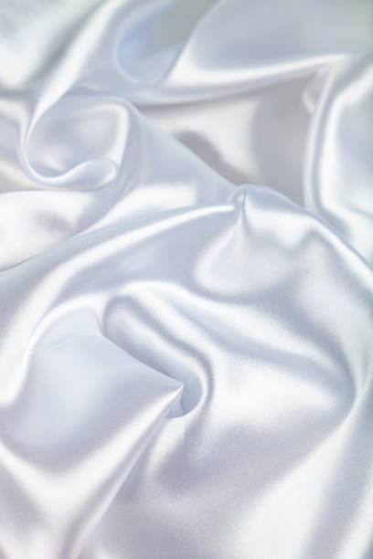 istock White silk fabric with folds. 1022358866