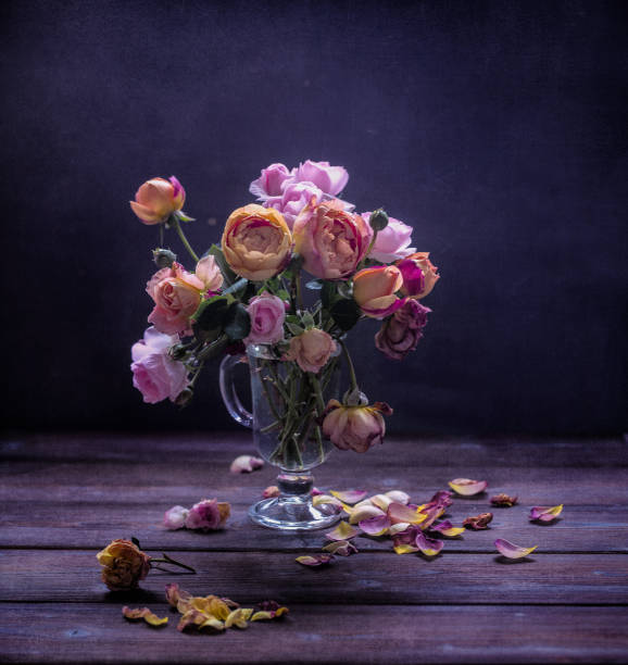 istock Still life with garden roses and glass 1022382726
