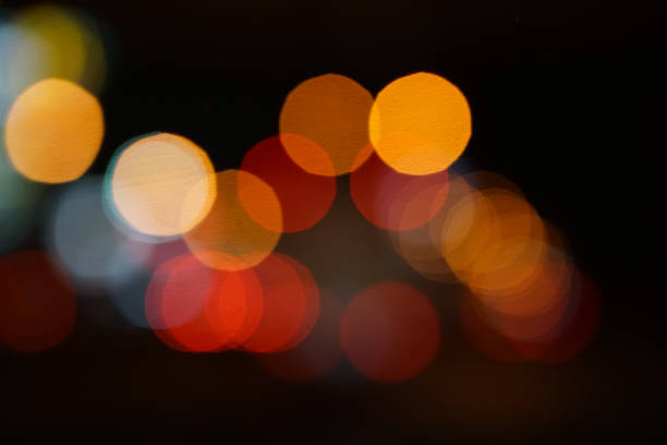 istock colorful street circle bokeh light dark background 1022385964