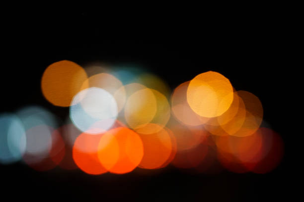 istock colorful street circle bokeh light dark background 1022386012