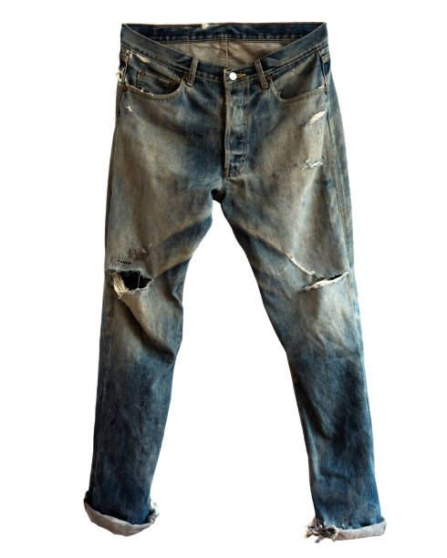 Ripped blue jeans isolated Blue jeans with ripped. Isolated on a white background. hole in pants stock pictures, royalty-free photos & images