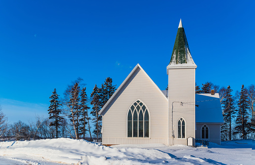 A simple country church after a snow fall.